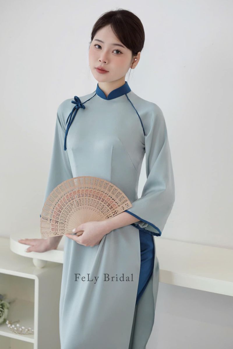 ao dai be trap mau xanh 3