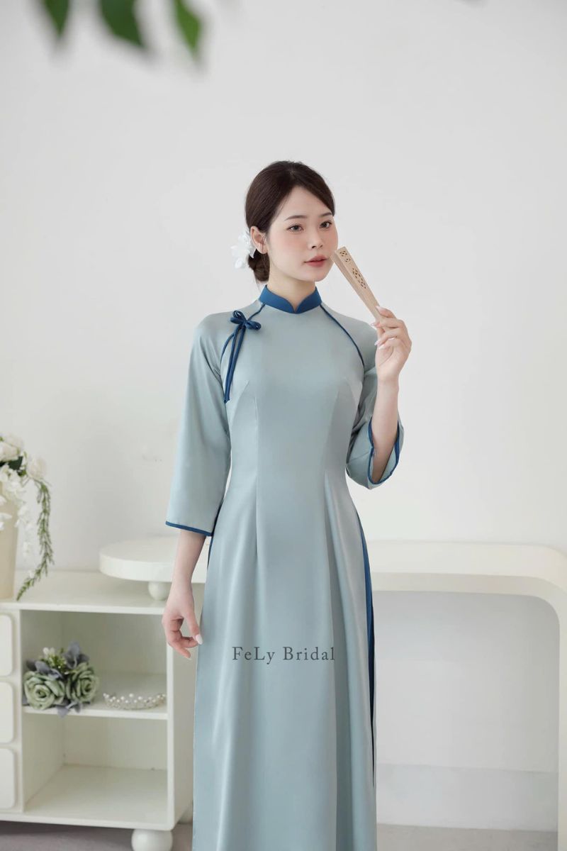 ao dai be trap mau xanh 9